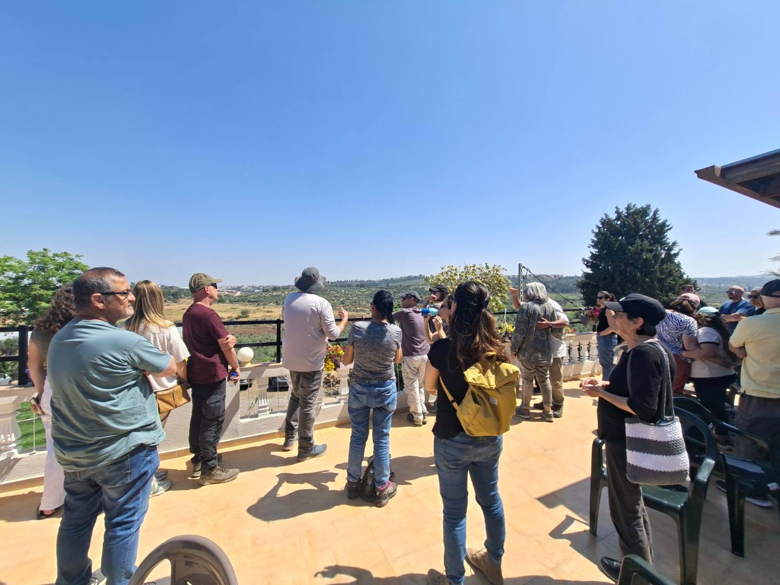Group on a terrace overlooking the valley